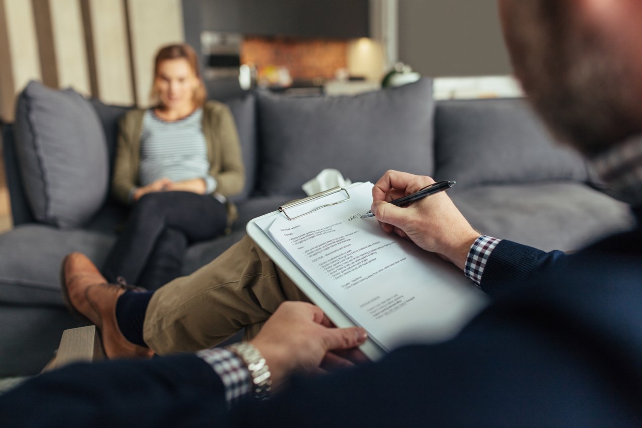 Psychologist during Therapy Session with Female Patient