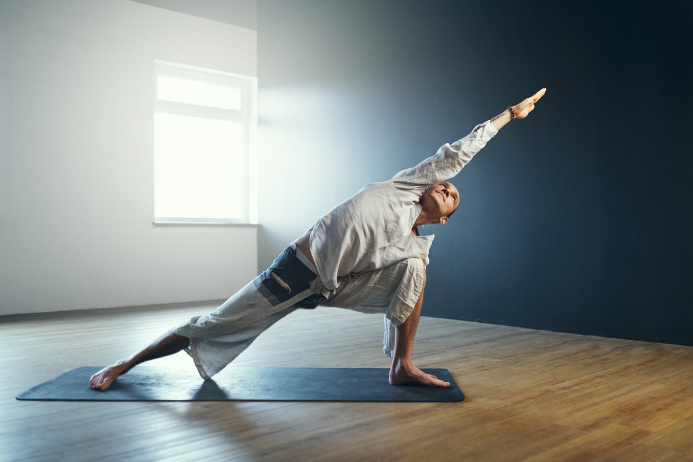 Man Practicing Yoga in Studio
